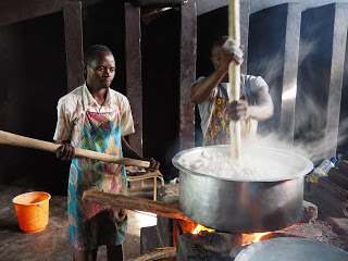 Cooking a large pot of food.